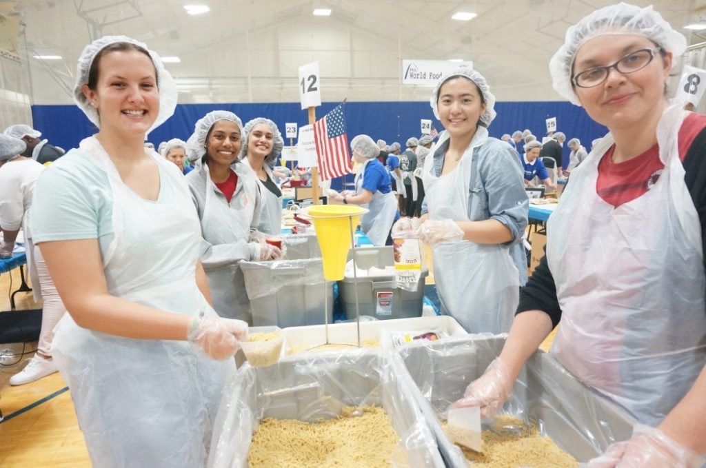 Students pack meals for World Food Day