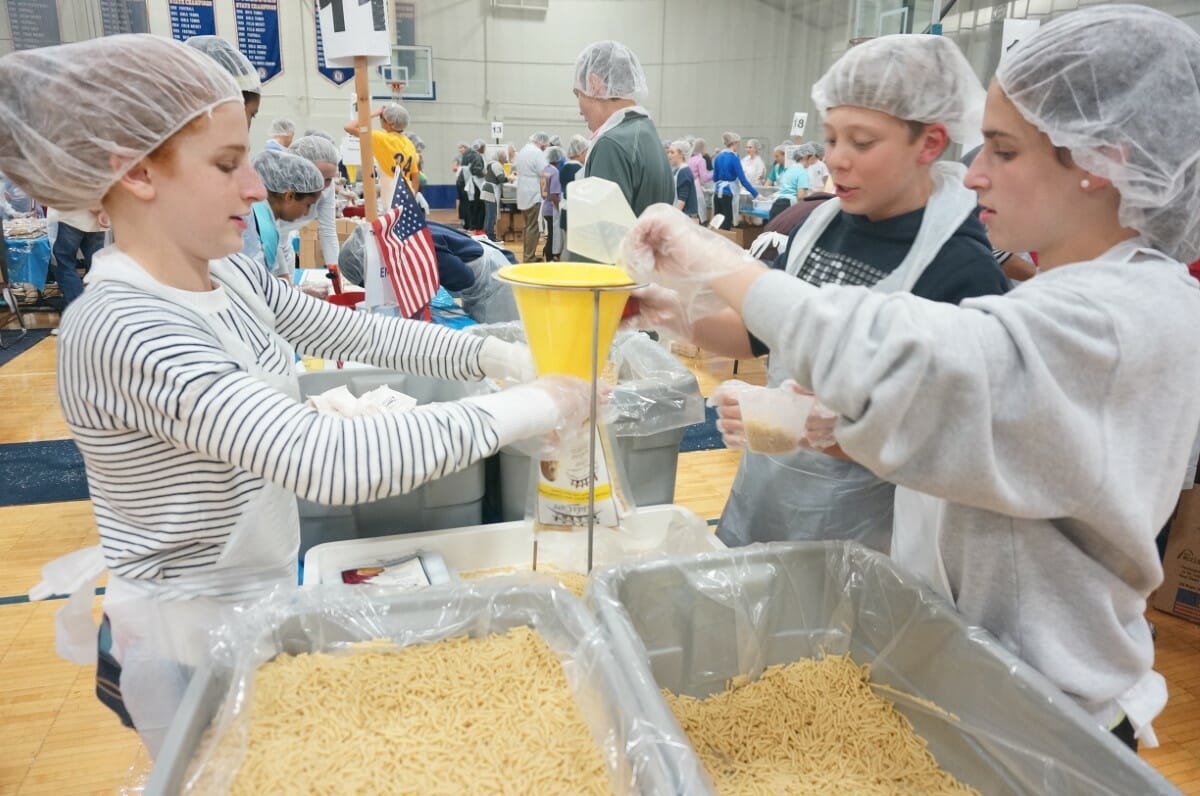 Students pack meals for World Food Day