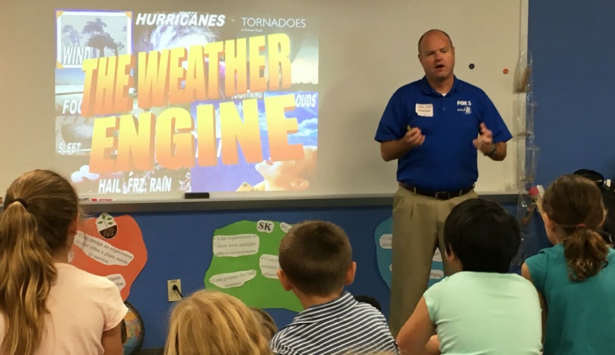 Meteorologist Chris Higgins speaks to the 3rd Graders