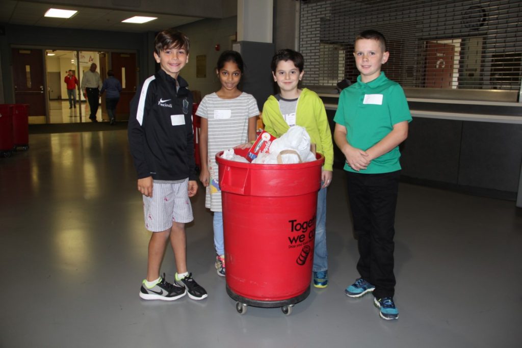 Students delivering Turkey Train goods to the bins