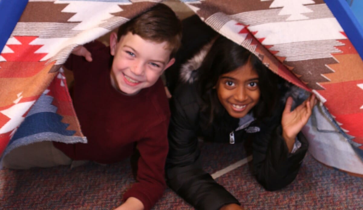 Students in a teepee for the Native American Indian Museum