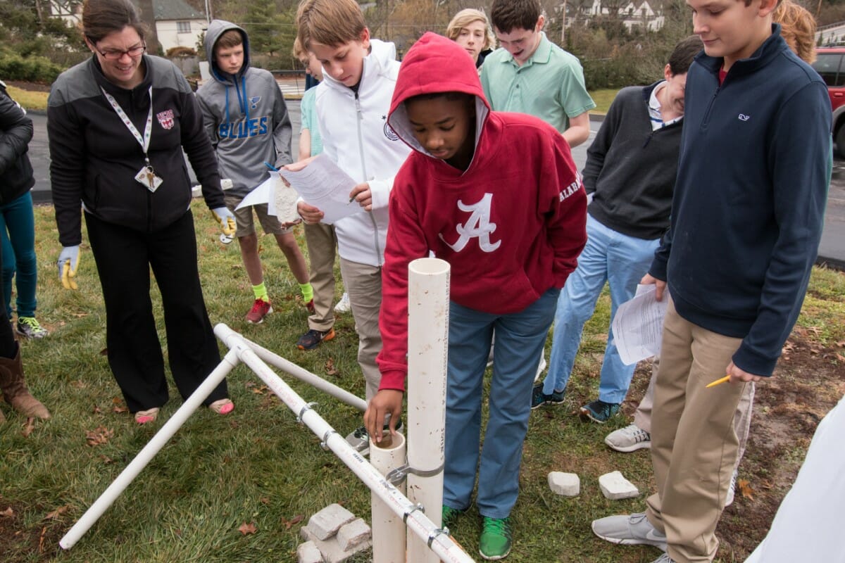 Students test the strength of cement blocks