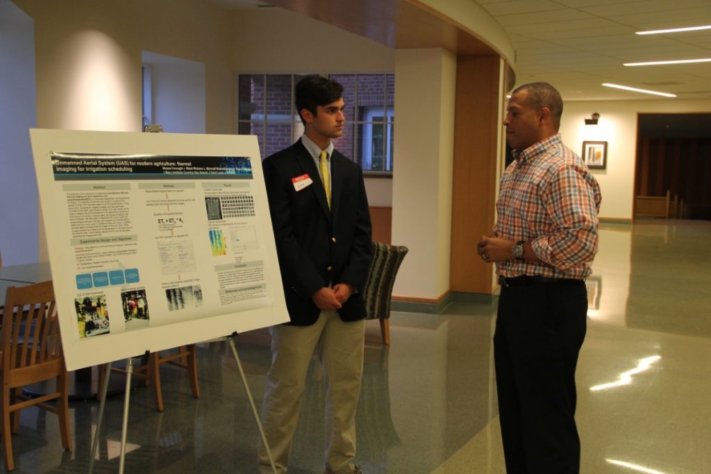 Students show off their projects at the STEM Research Symposium