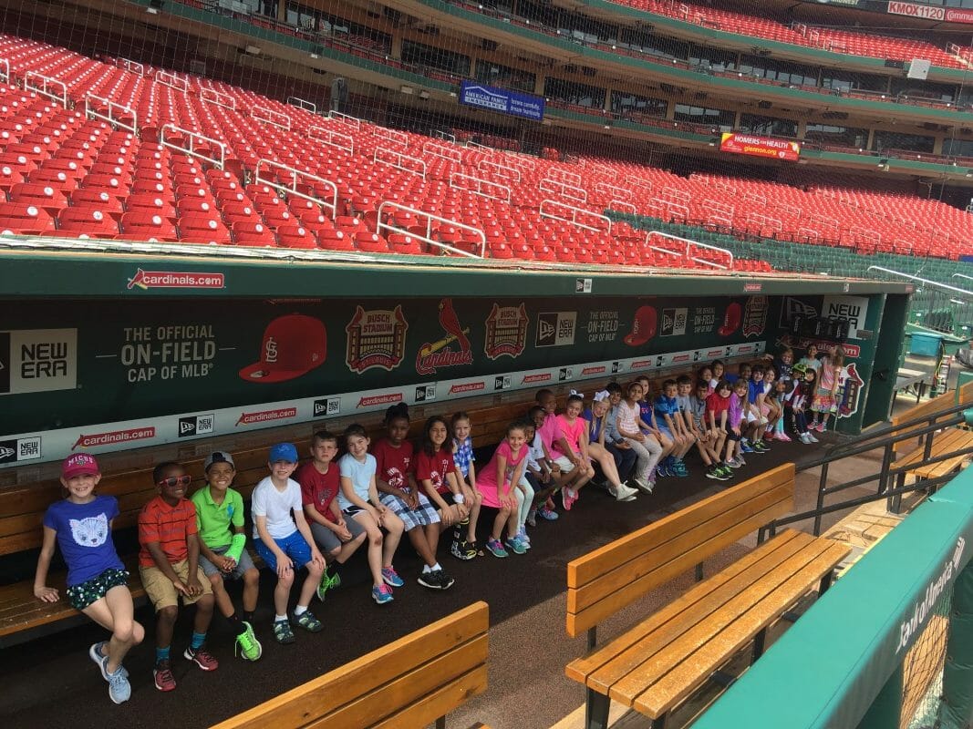 Students in the dugout at Busch Stadium