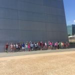 Students at the base of the arch