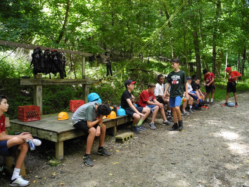 Students sitting at Camp Wyman and preparing for a ropes course