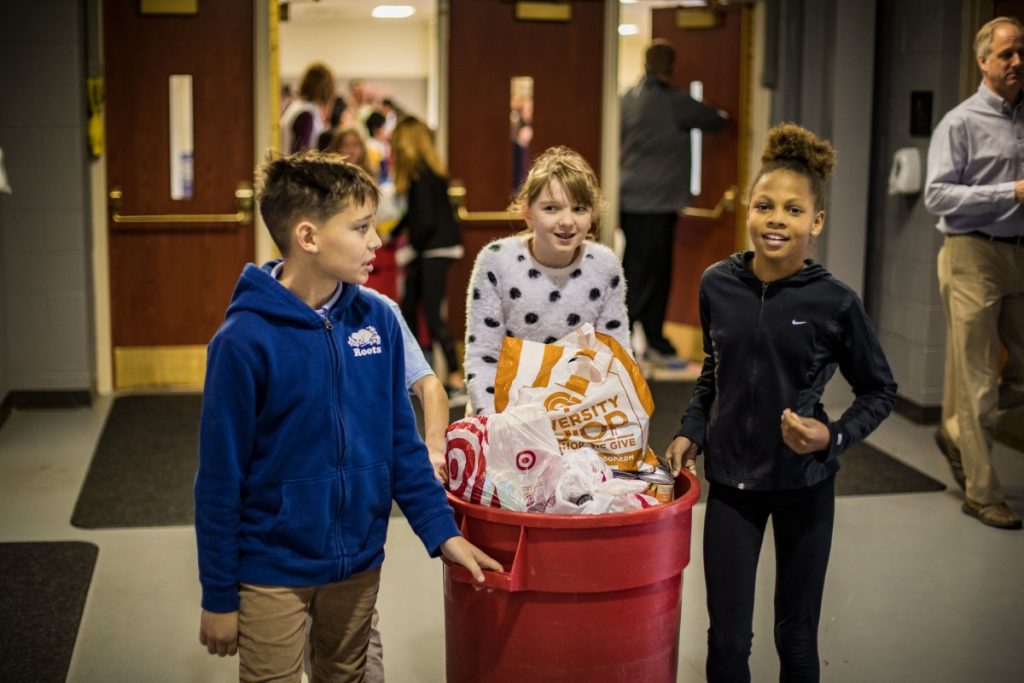 Lower and Middle schoolers bring canned goods for Turkey Train