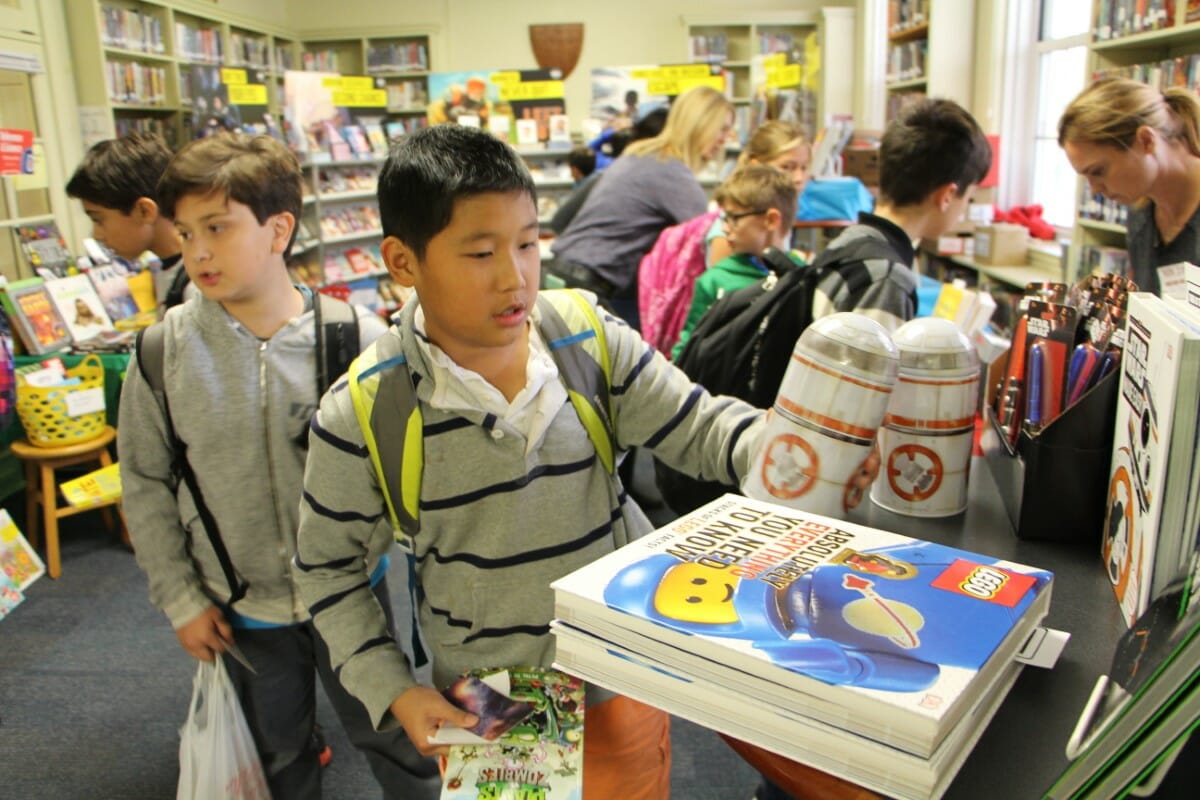 Students browse at the first Middle School Book Fair