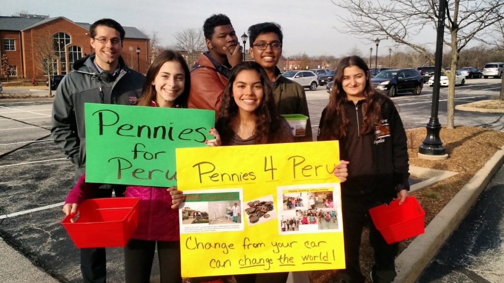 Students collect change for Pennies for Peru