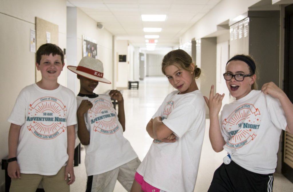 Fifth graders pose for adventure night