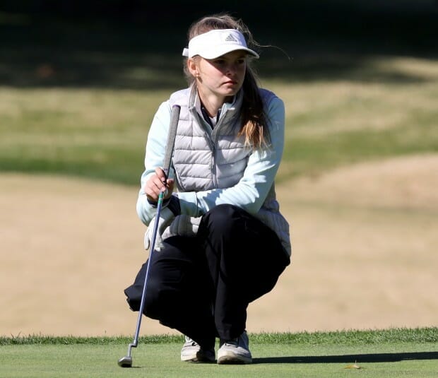Katie Mikulec playing golf at state