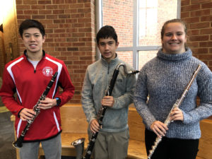Students holding band instruments