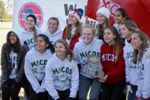 Girls Cross Country team holds district championship plaque